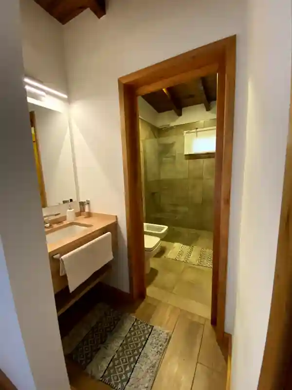 Shared bathroom between secondary room and third room