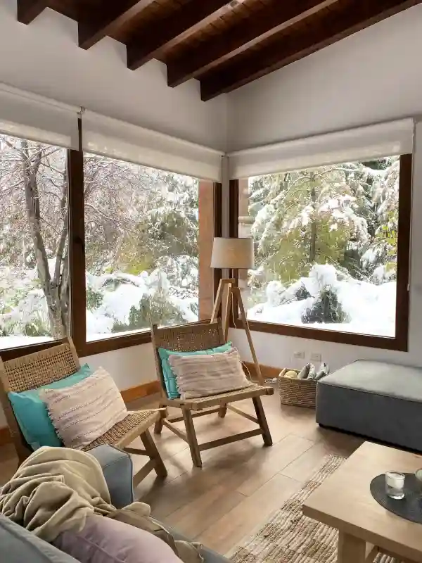 Cozy corner of the living room with the snowy garden in the background