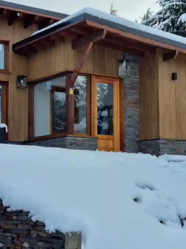 Snow covered house entrance