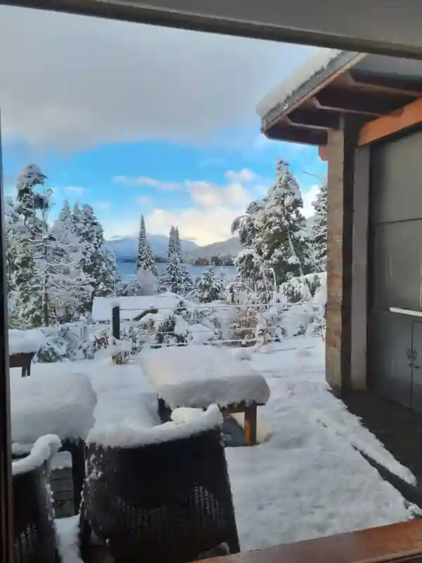 Snow covered deck looking out to the lake